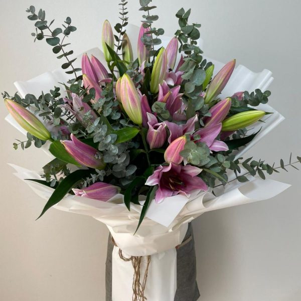 10 pink lilies with eucalyptus