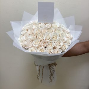 50 White roses in white wrapping